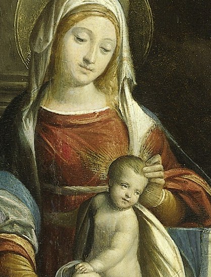 Her gentle gaze and soft features convey a sense of maternal love and divine peace.