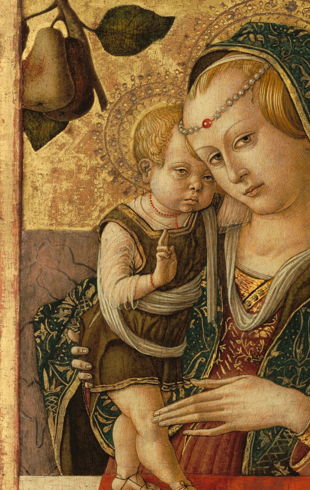 Crivelli's textile rendering borders on trompe-l'oeil , the raised gold thread and foliate borders are built up in relief paste, a tactile virtuosity invisible in reproductions until light rakes across the surface.