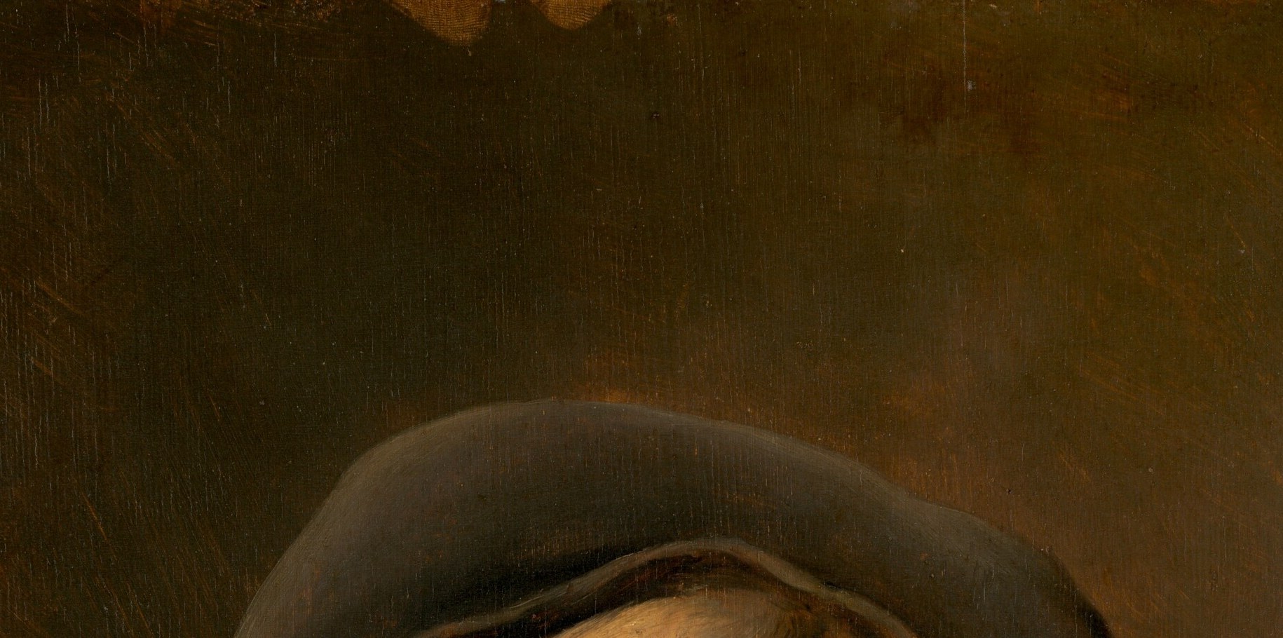 The beret sits low and heavily on the head, its near-black shadow contrasting with the luminous face below , a classic Dutch tronie costume device