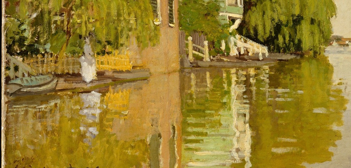 The water holds a perfect mirror of the house and willows.
