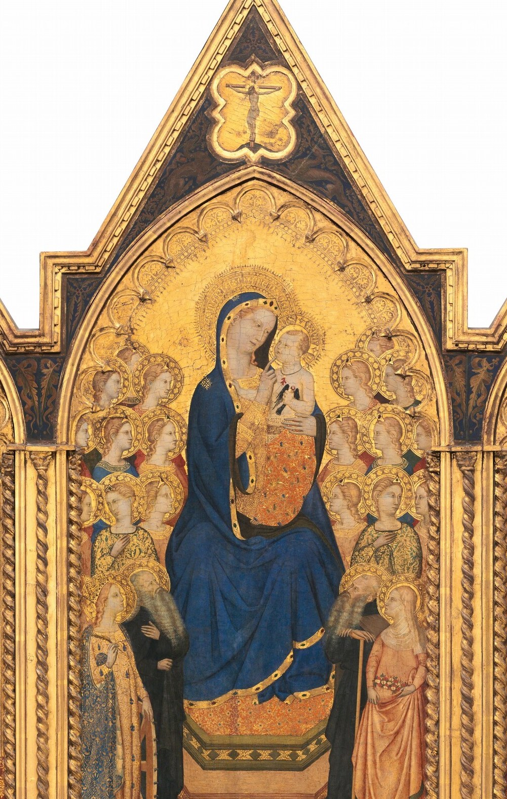 This is not sky or atmosphere , it is divine light materialized; even in a soft reproduction the gold's refusal to recede into pictorial space announces that the scene occupies eternity, not a room.