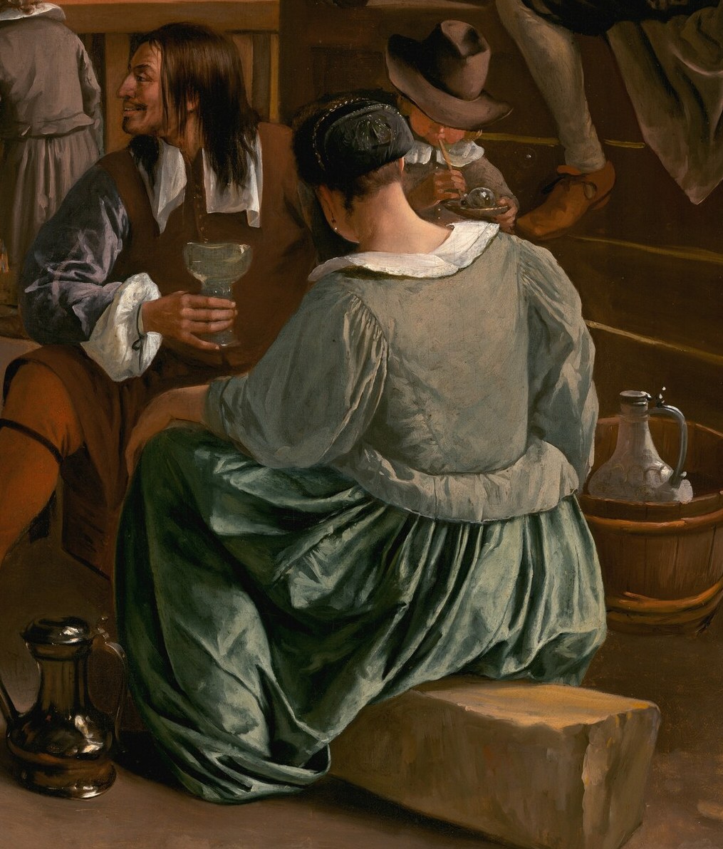 Her relaxed posture and gaze towards the dancers suggest she is enjoying the spectacle, embodying the viewer's perspective.