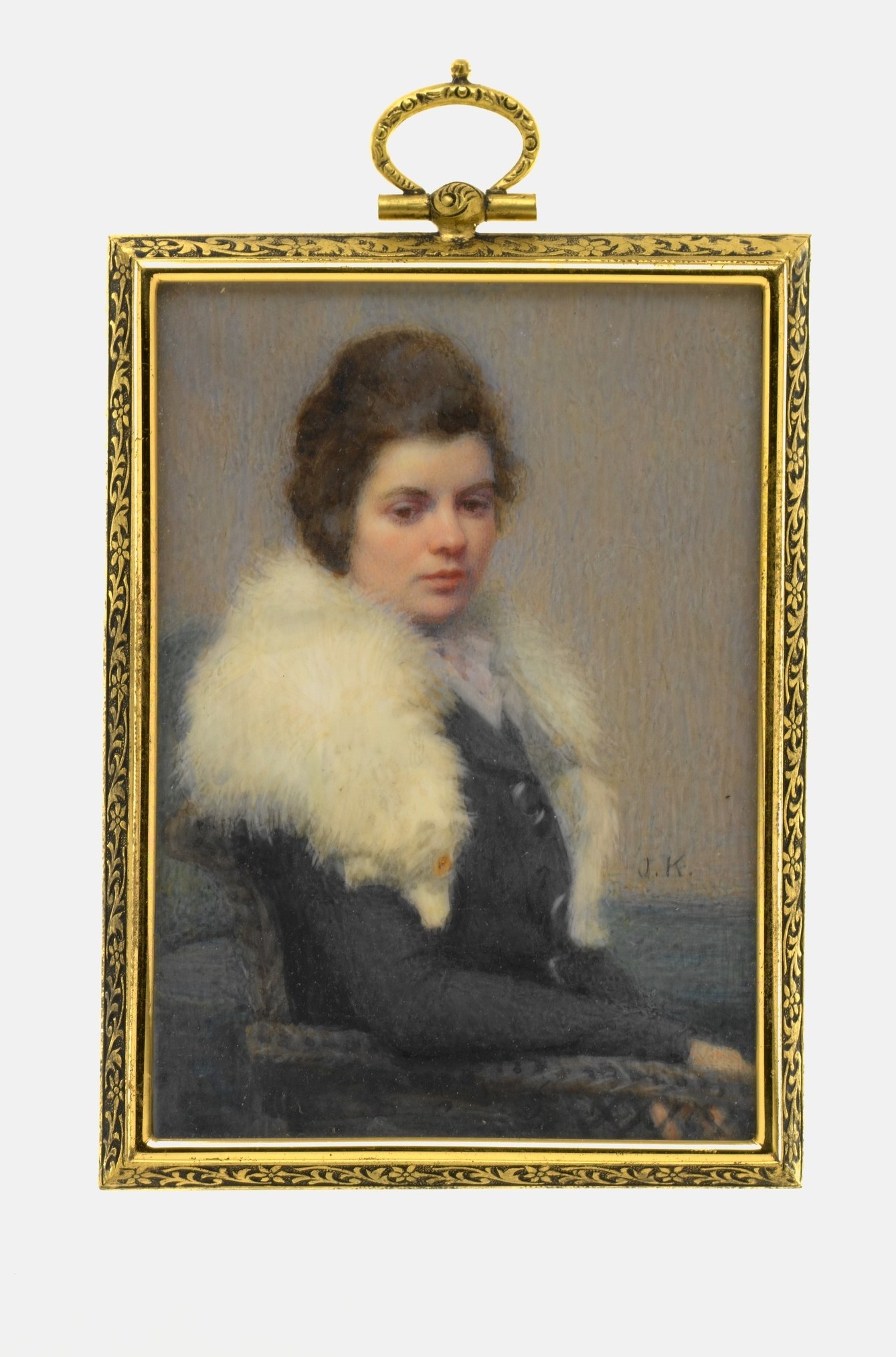 The elaborate frame is itself an artefact of 1920s American miniature culture; its luxury echoes the fur and signals the work's intended place in a wealthy household.