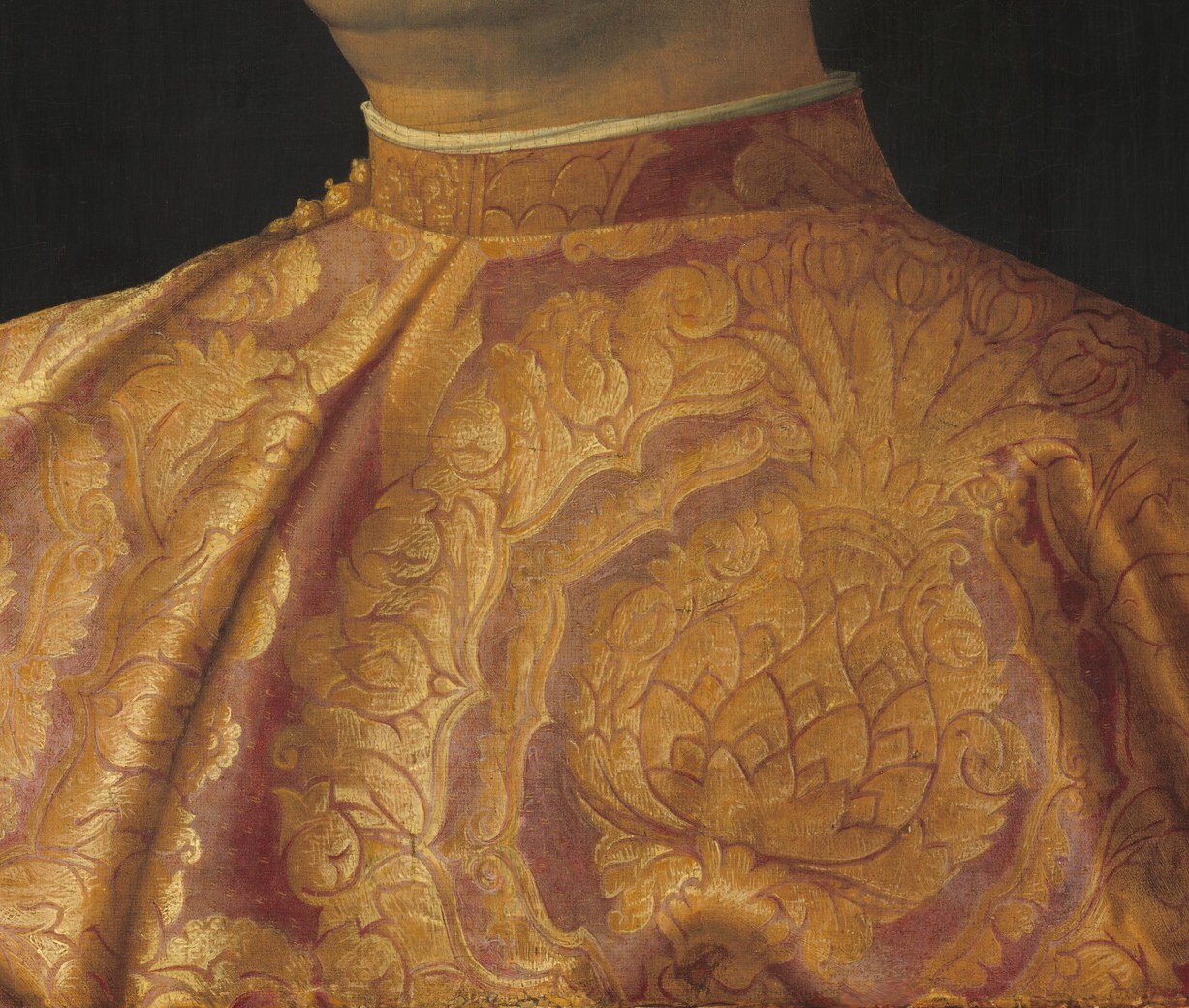 The densely patterned damask is a tour de force of illusionistic texture , Bellini renders the raised velvet pile and gold thread so that fabric status speaks louder than any inscription