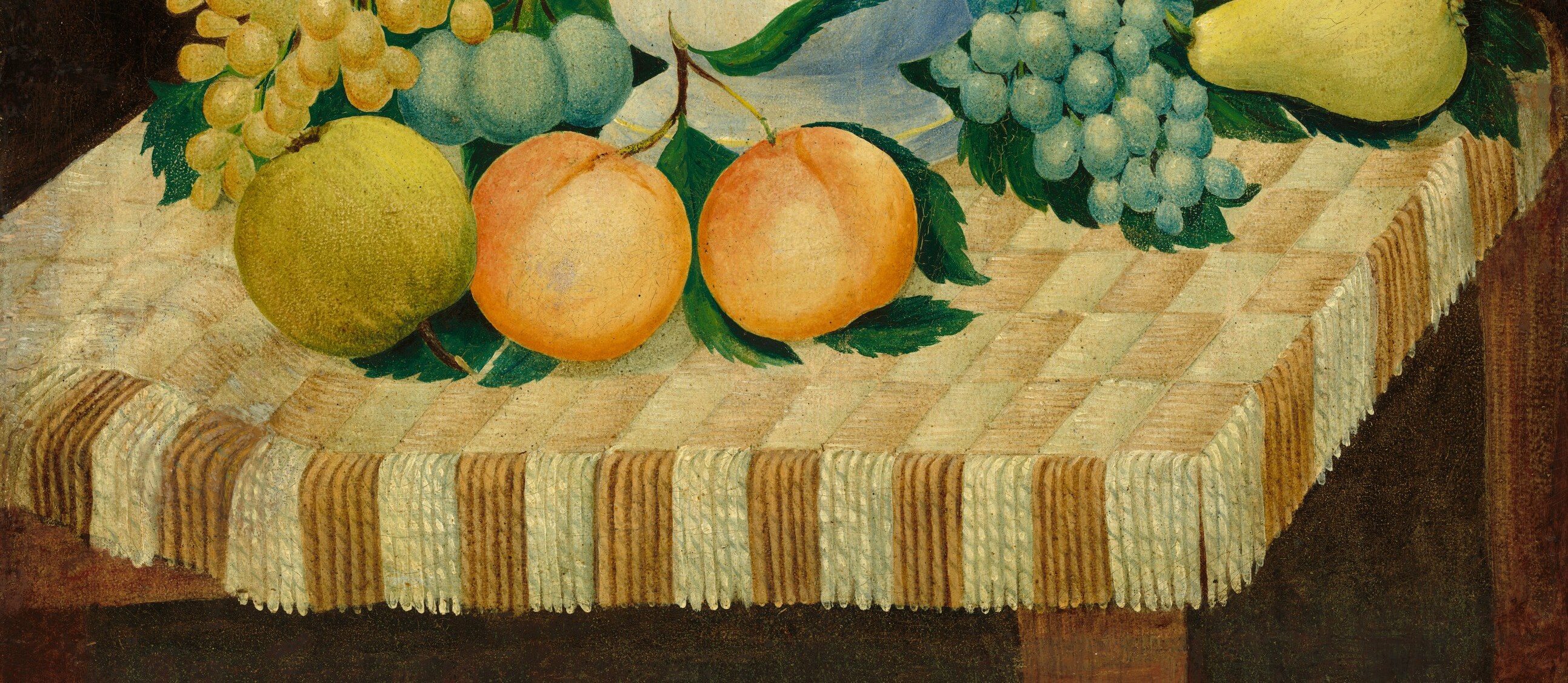 The patterned cloth grounds the still life, its texture and fringe adding a tactile quality and suggesting a domestic setting.