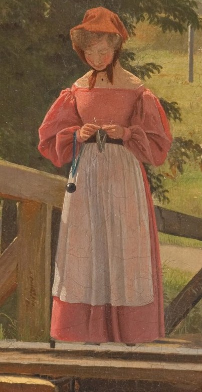 She seems to be knitting peacefully.