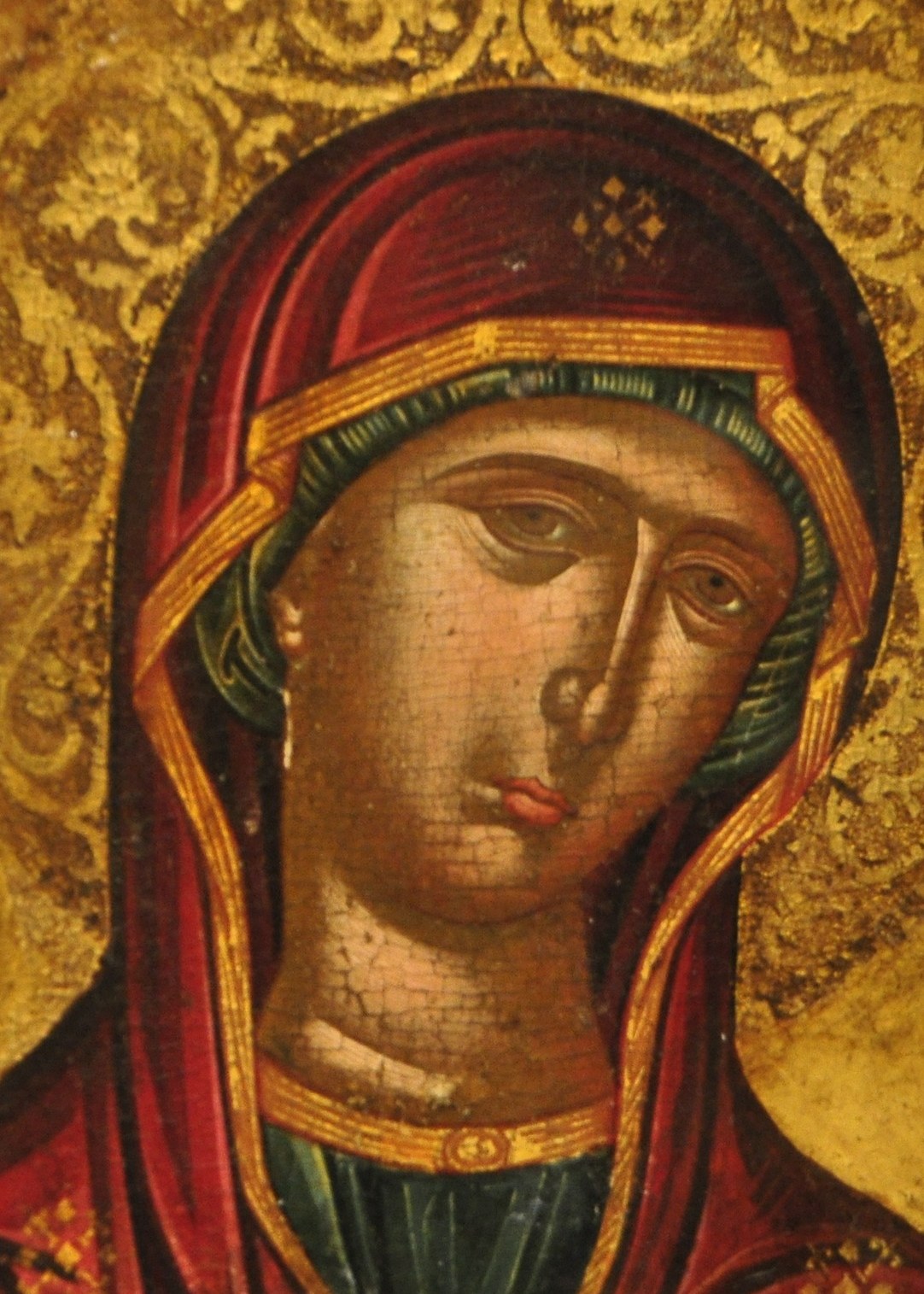 The radiant halo signifies divinity and spiritual illumination, rendered with intricate Byzantine patterns.