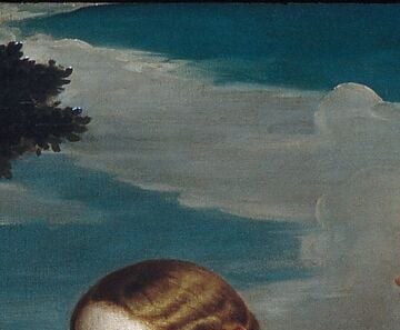 She watches him openly. Her gaze is steady.