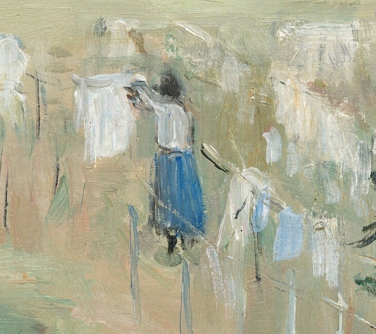 Beneath the clothesline, two figures work together.