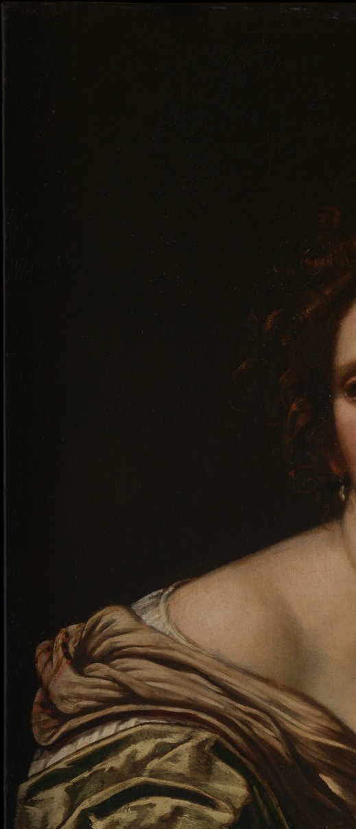 Vouet's deep shadow, characteristic of his Roman Caravaggesque period, eliminates all setting context and forces total attention onto the lit figure , a deliberate rhetorical choice.