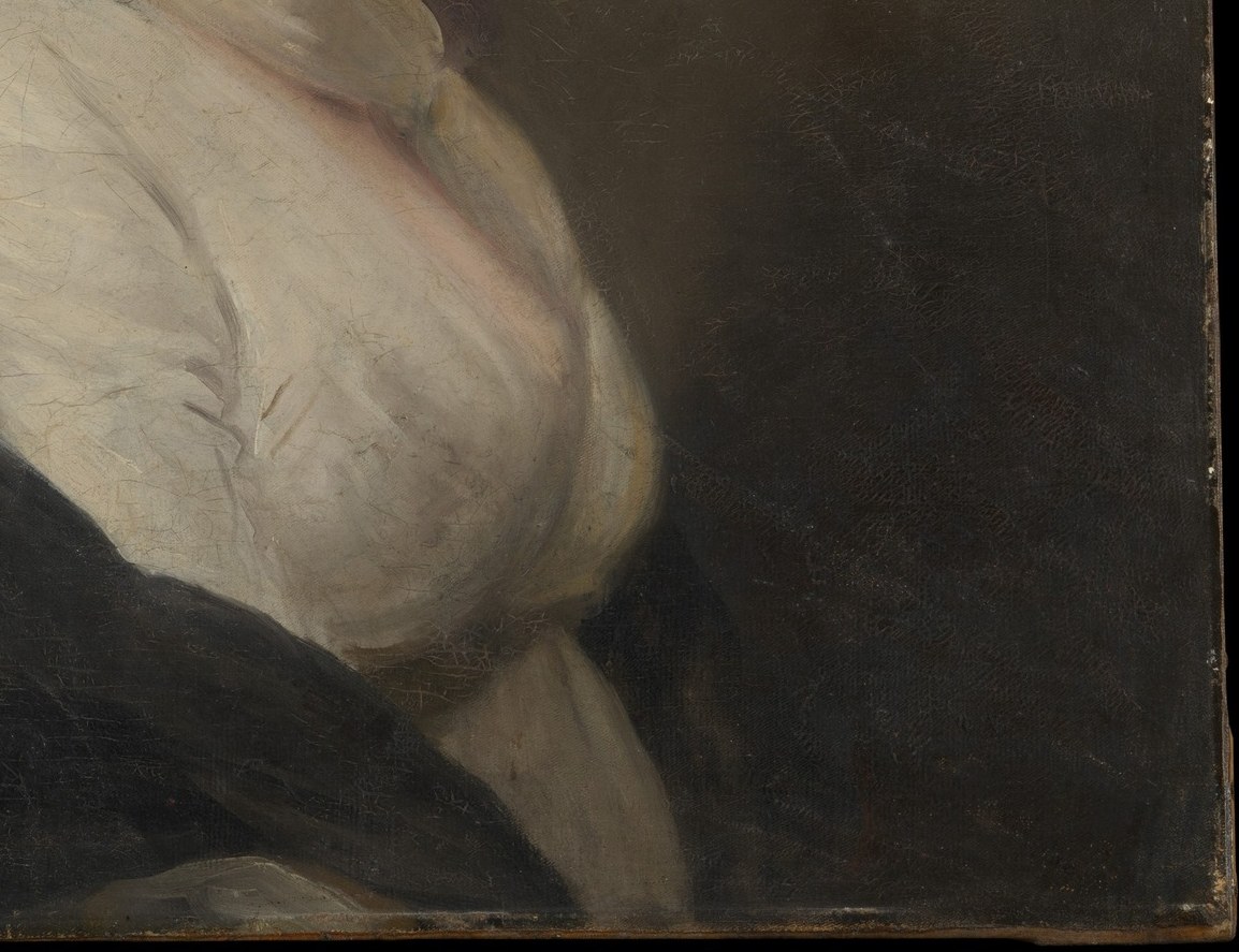 The dark shawl drapes her left shoulder.