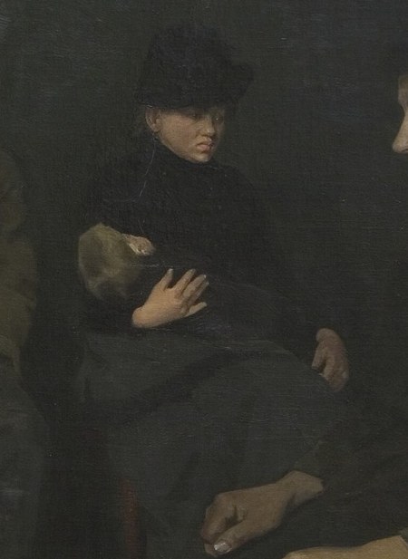 A man holds a child's hand tightly.