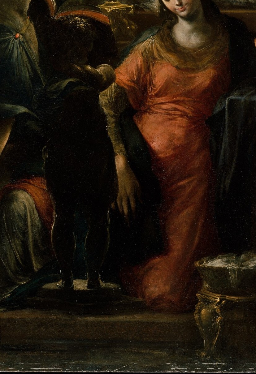 The warm red reads as fire against the dark interior , Bedoli uses color to mark Mary's humanity against the cooler angelic tones