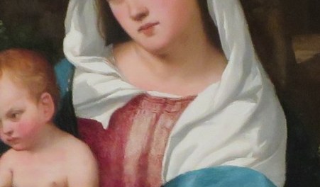Her calm gaze and gentle expression convey maternal love and divine grace.