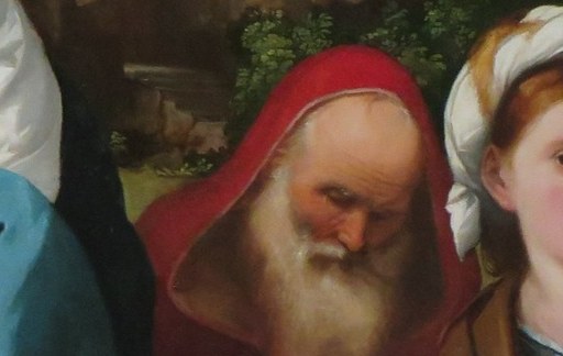 And Saint Anthony the Abbot, identifiable by his red hood.