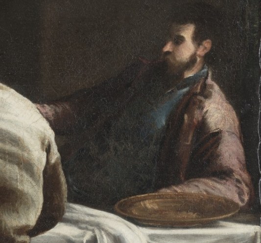 The rich man feasts, ignoring all.