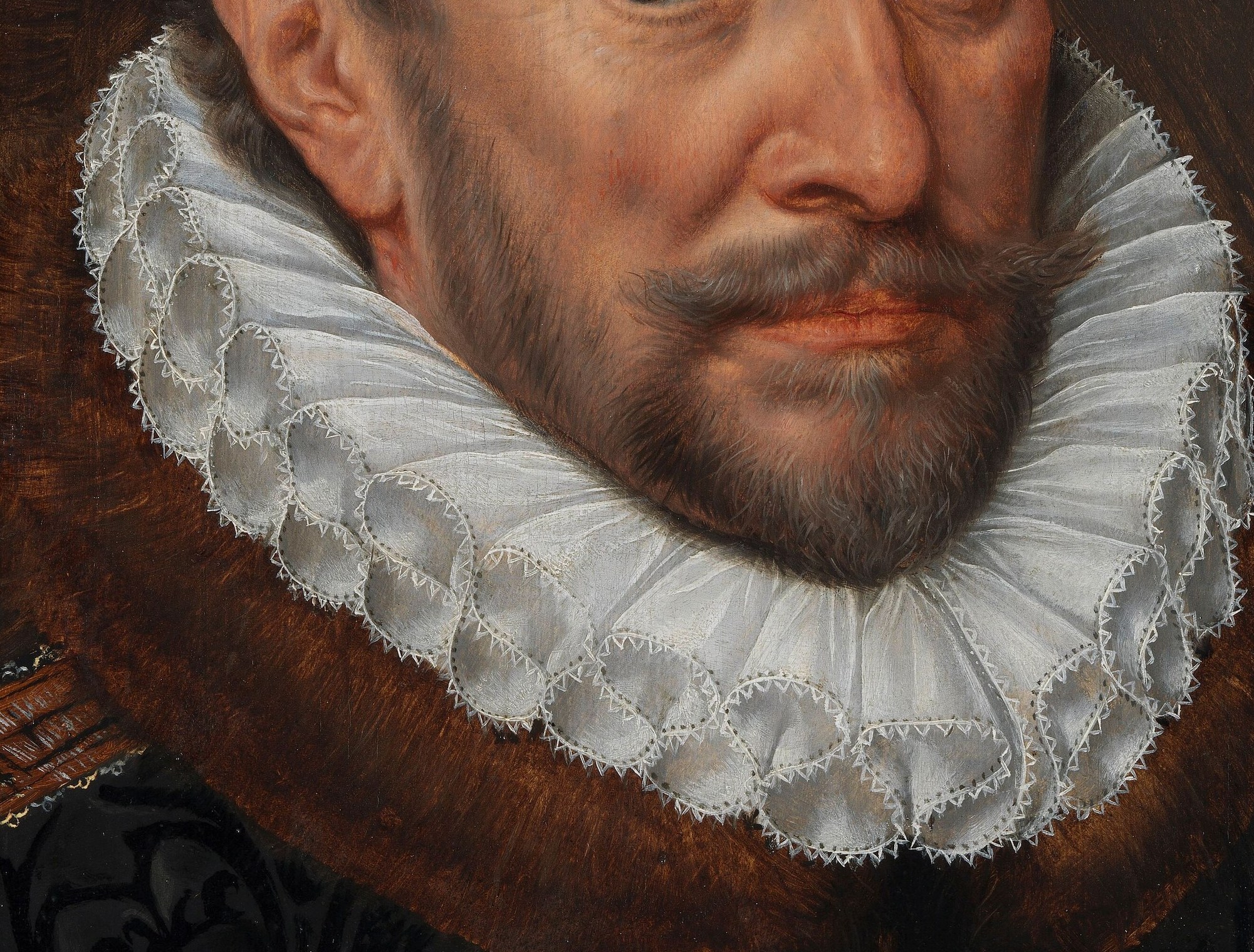 The intricate ruff and gold embroidery symbolize his status.