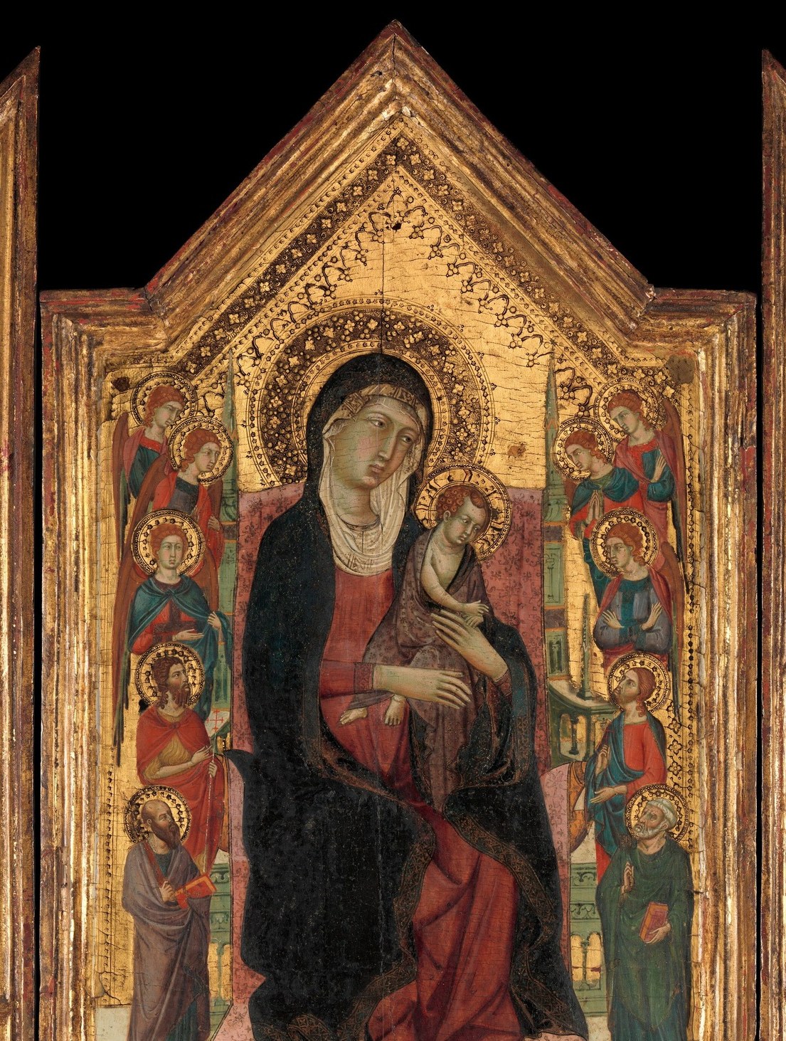 The gold leaf creates a heavenly non-space; even in this reproduction the micro-texture of the punchwork around the halo edges is faintly visible , a hidden detail at close range
