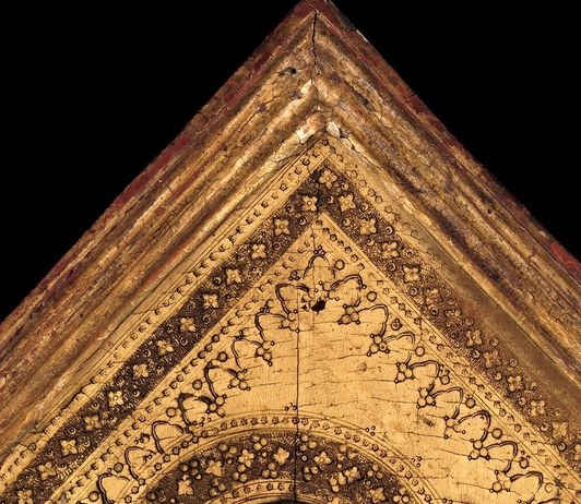 The pivot of the entire triptych , her gaze is slightly averted downward yet serene, projecting the Sienese ideal of maternal gravity over tenderness