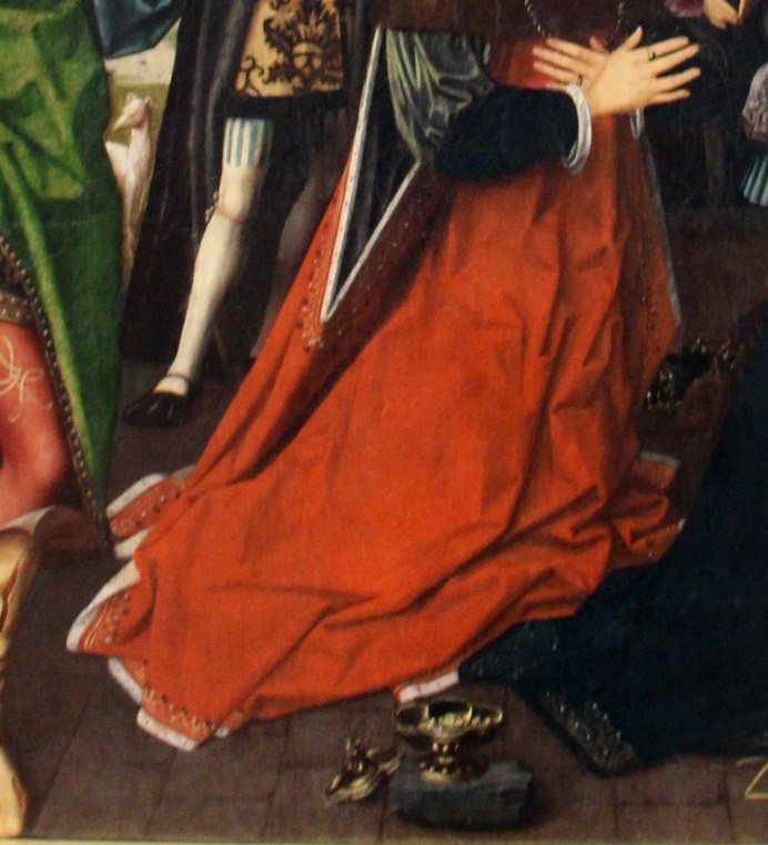 The kneeling Magi's red robe shows rich texture and folds.