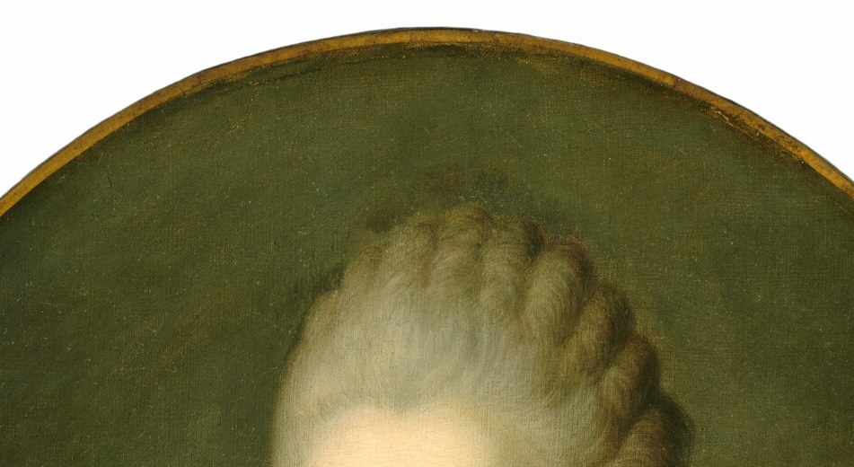 The swept-up, powdered construction signals aristocratic status; its artifice contrasts sharply with her commoner origins as Jeanne Bécu.