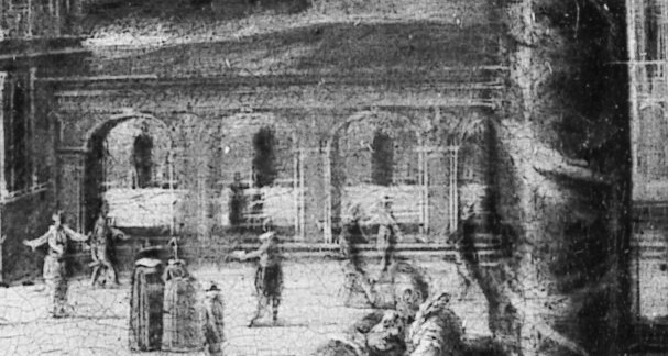 People walk beneath the arches.