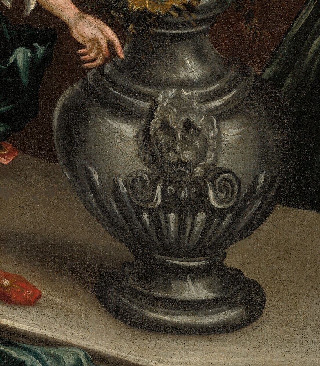 Next, this ornate silver vase, overflowing with blooms.