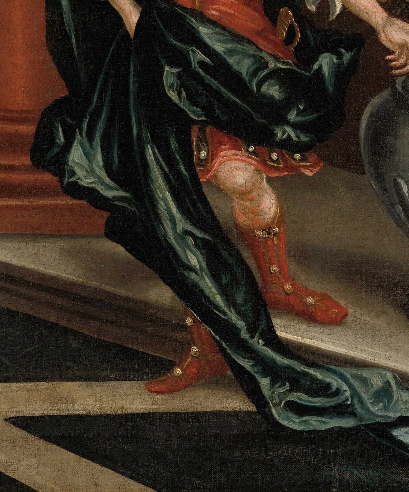 His red and green outfit is elaborately detailed.