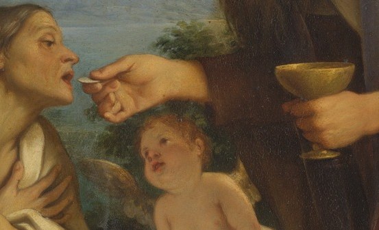 The priest places the host on her tongue with a liturgical spoon.
