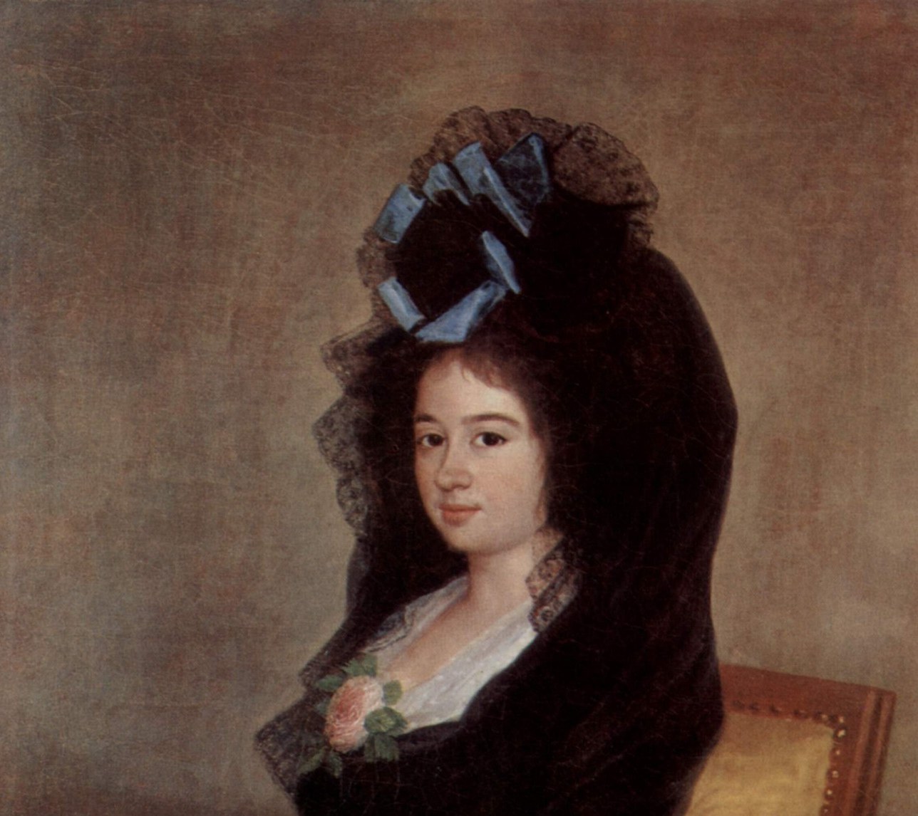 The voluminous mantilla dominates the upper canvas and frames the face; in 1815 Madrid it was both fashion and identity marker for prosperous Spanish women