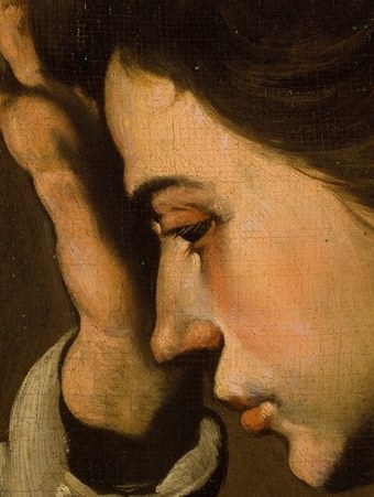 Her hand on her forehead suggests deep thought.