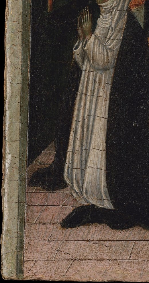 A woman kneels in the street, locked out of the room where her mother lies dying.