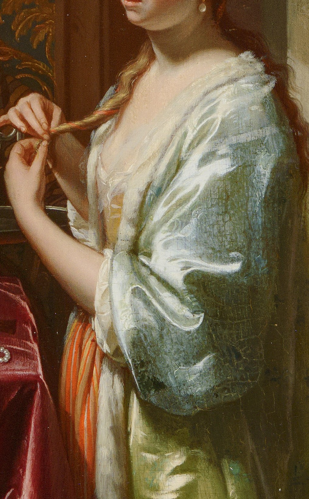 She is brushing her blond hair.