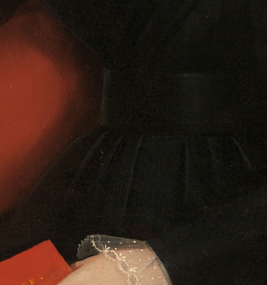 This red book signals literacy and intellectual virtue.