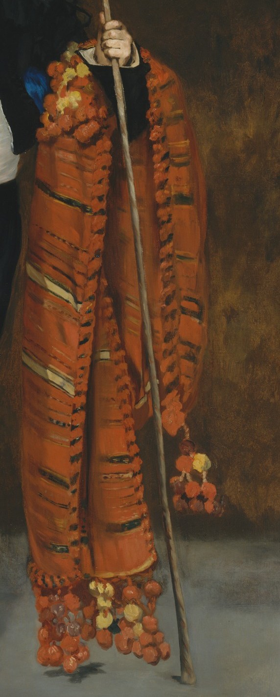 The most texturally alive passage in the painting , thick impasto strokes build the velvet folds; the warm ochre-orange anchors the right half of the composition and echoes bullfighting regalia