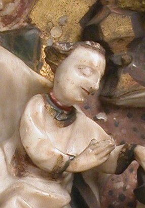 Mary presents her child, who reaches out to touch.