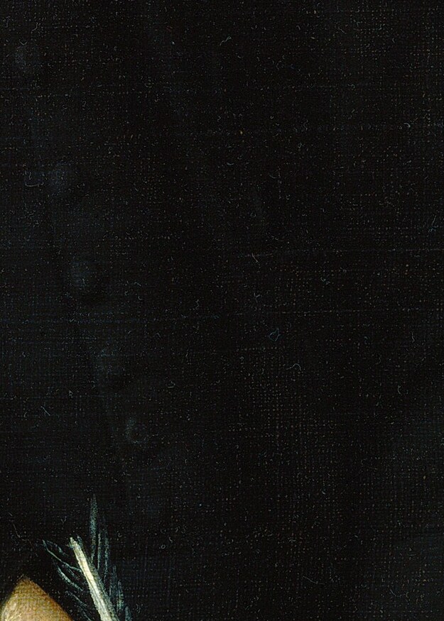 But look closely at the page beneath his pen.
