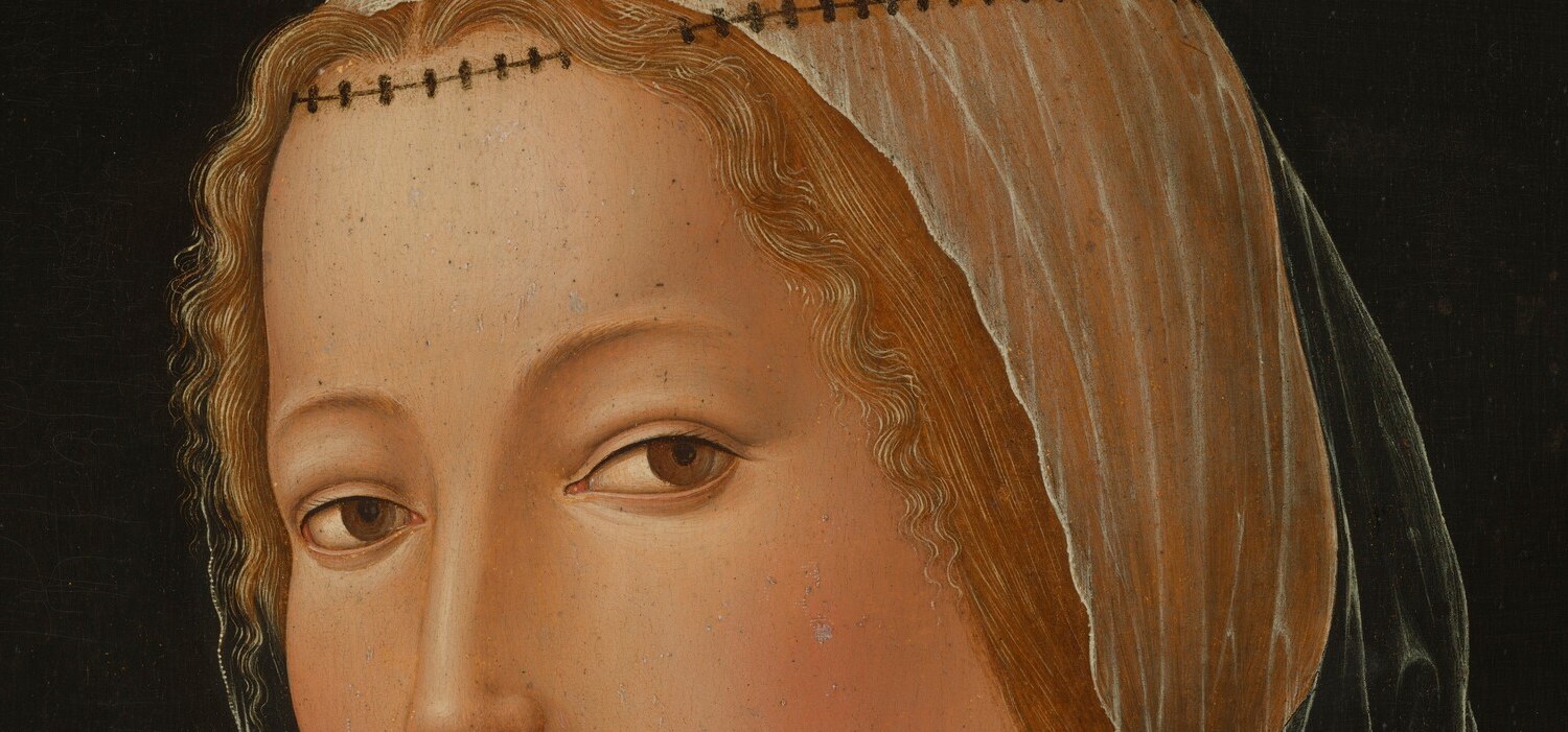 The eyes meet the viewer without aggression , a subtle asymmetry between them gives the face life and individuality beyond a generic ideal.