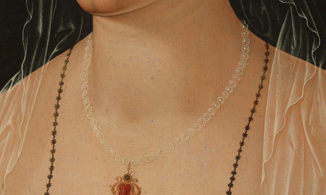 The red pendant at her sternum signaled virtue and prosperity.