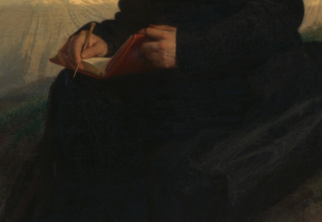 Look at what he holds. Not a book. Not a globe.