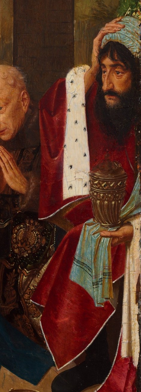 His rich attire and offering suggest the worldly power and wealth brought to honor the infant king.