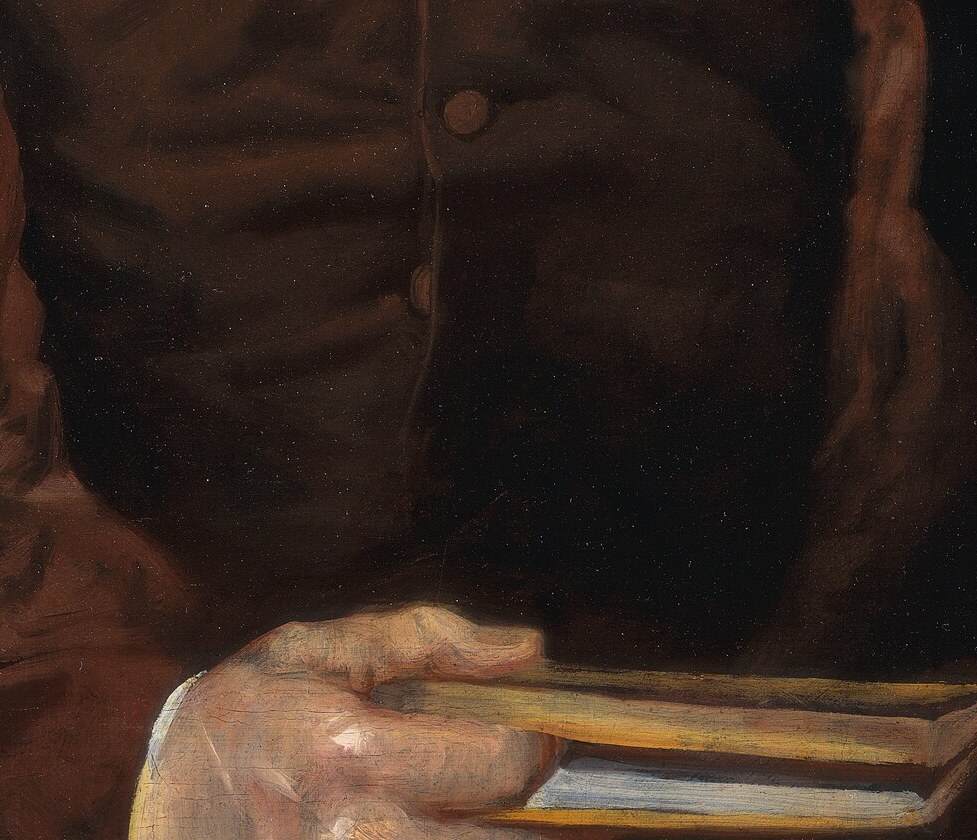 It's the only prop in the portrait, a sign of a life of law and letters.
