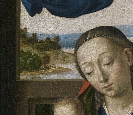 Her downcast eyes and gentle expression convey a sense of quiet devotion and maternal love.