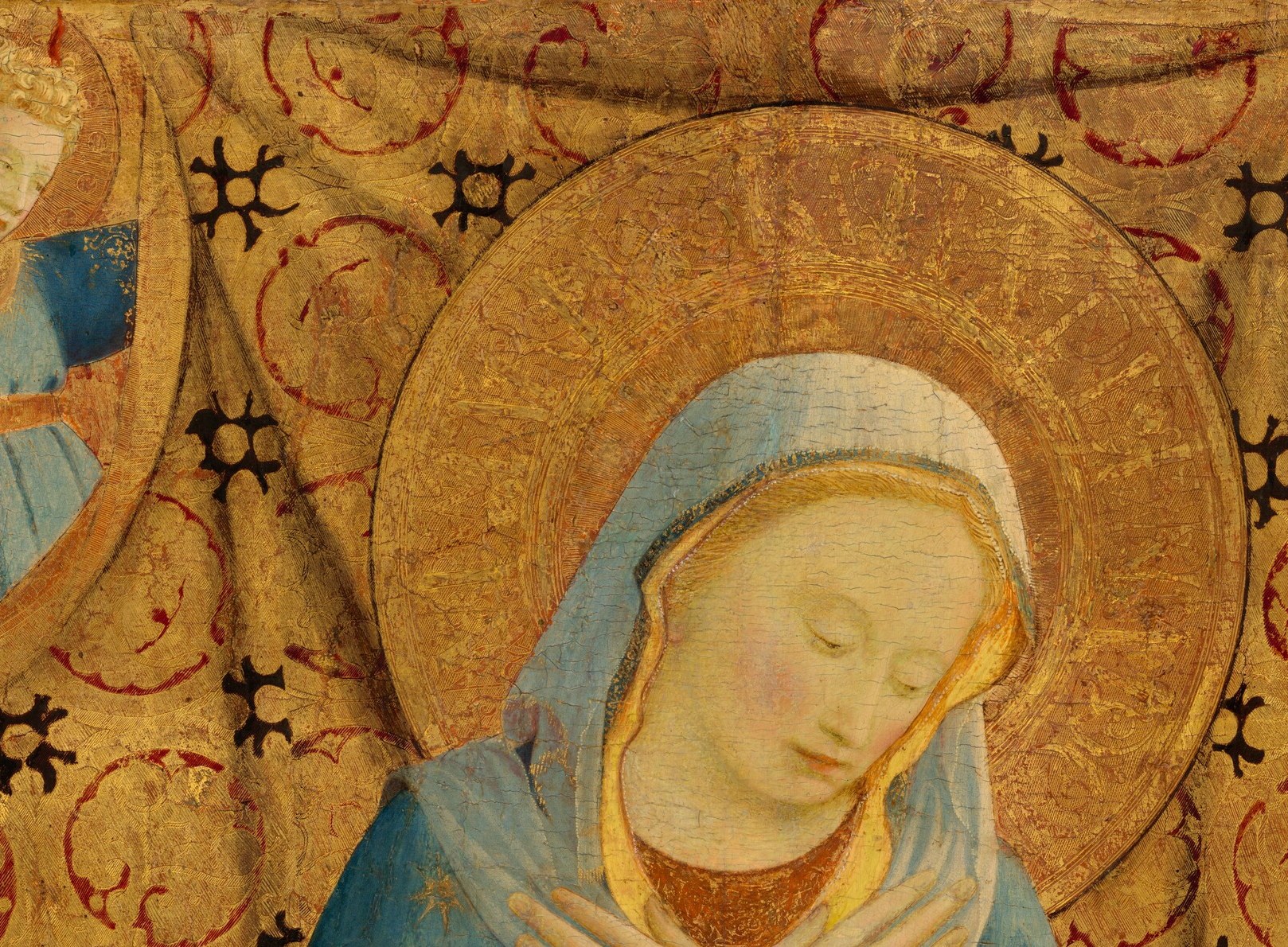 The punched and incised gold leaf catches light differently from every angle , a virtuoso technique passage in tempera on panel.