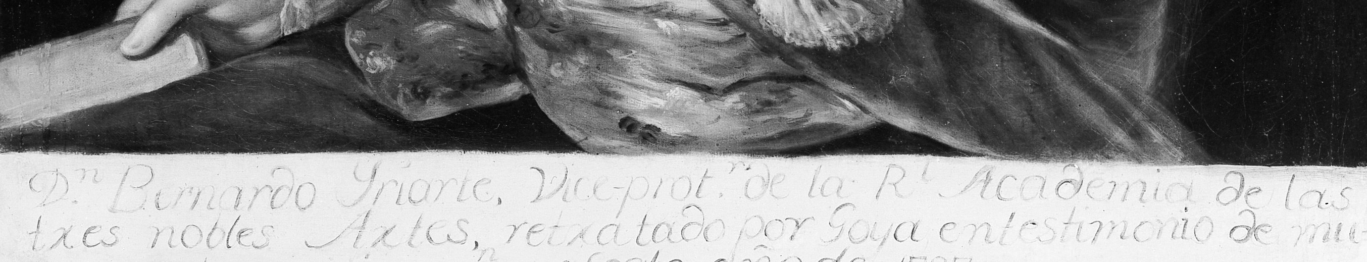 A painted inscription runs along the lower margin.