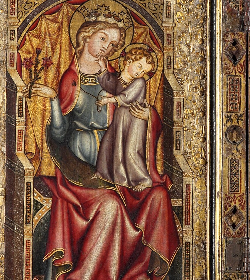 The Virgin holds her child tenderly.