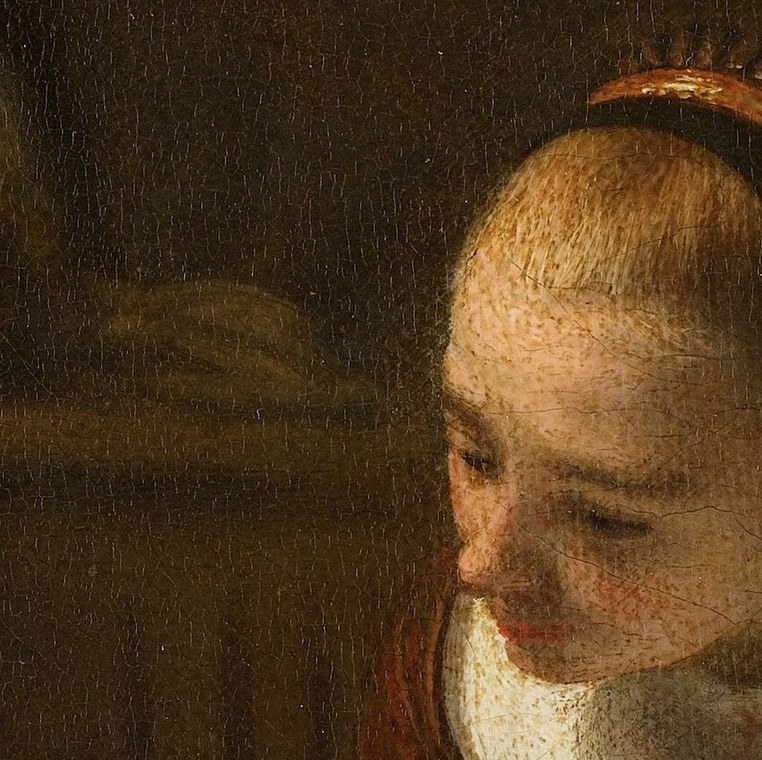 Her calm expression suggests focus on the book or child.
