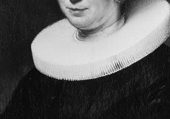 Her starched white collar appears to stand out from the canvas.