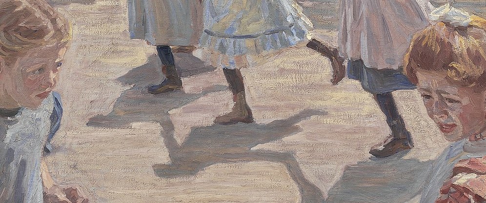 Shadows stretch long on the warm pavement.