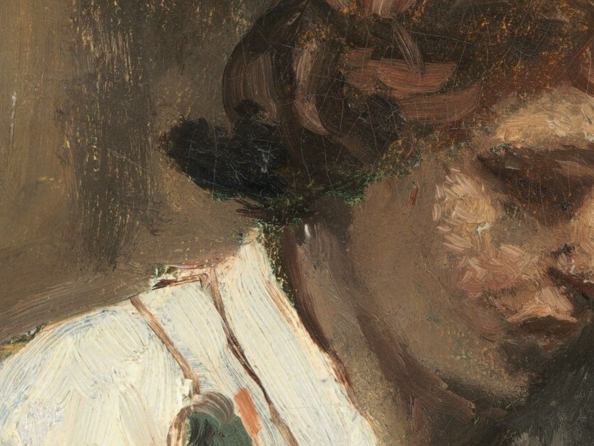 Her profile is softly rendered, suggesting a moment of private thought and absorption.